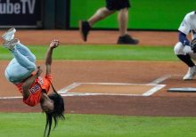 Simone Biles adds flip and twist to her first pitch at Game 2 of World Series