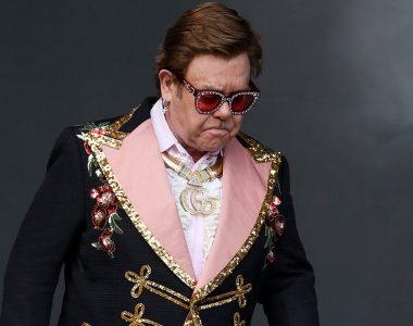 Elton John tearfully escorted off stage after losing his voice mid-concert