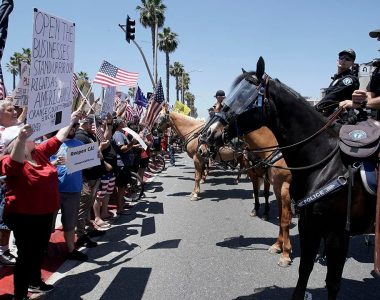 Huntington Beach protesters assail California Gov. Newsom's order closing beaches