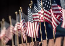 Massachusetts hospital worker helps plant 500 American flags after coronavirus forces Boston to cancel annu...